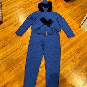Woman Blue One Piece Snow Suit with Black Fur Trim, Gloves, and Belt. Runs Small